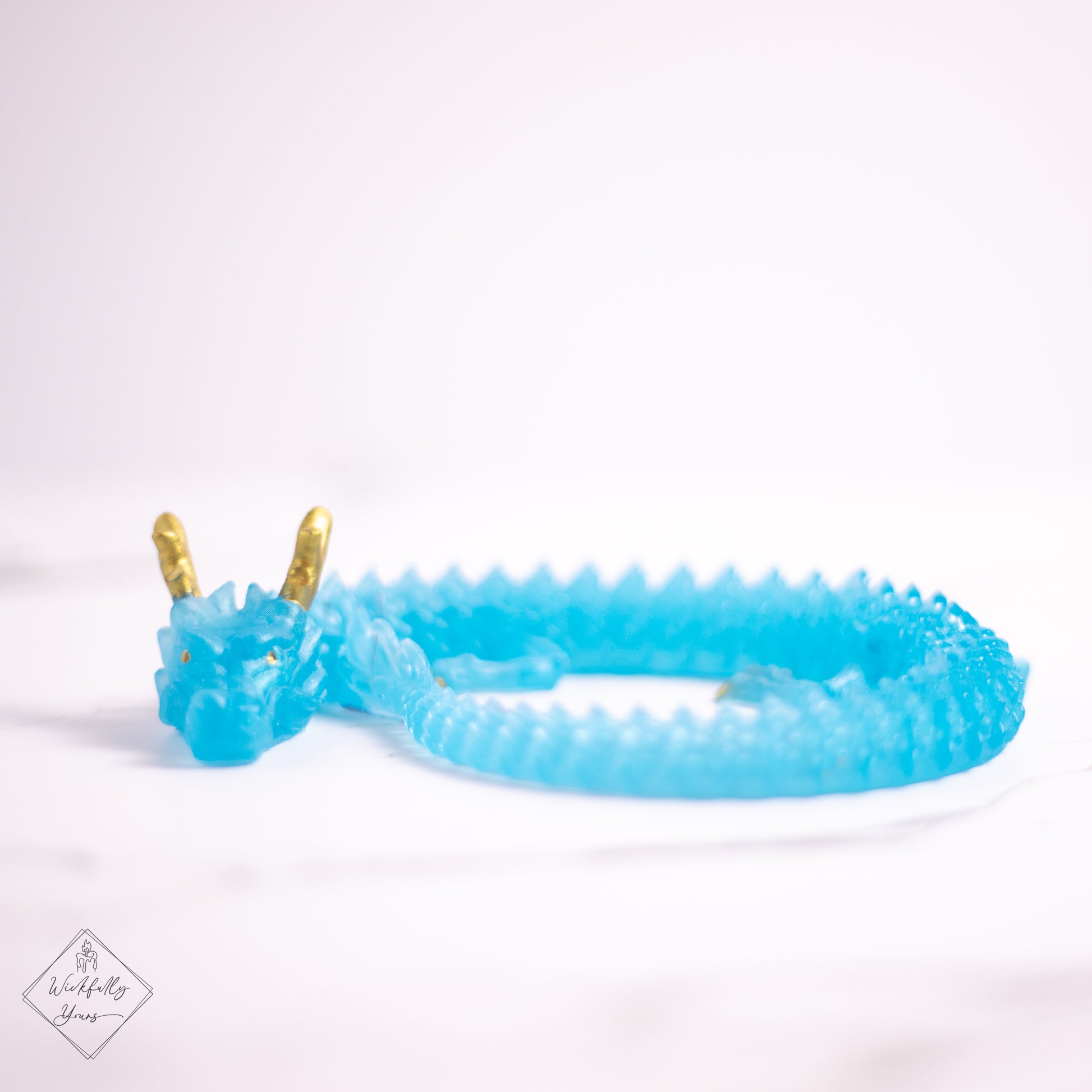 Blue coiled dragon resin art front